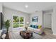 Bright living room with sliding glass doors and contemporary decor at 302 Ave P Nw, Winter Haven, FL 33881