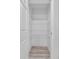 Walk-in pantry has wooden floor and four wire rack shelves at 302 Ave P Nw, Winter Haven, FL 33881