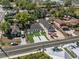 Aerial view of a newly constructed home with a dark roof and manicured lawn at 304 Ave P Nw, Winter Haven, FL 33881