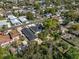 Aerial view of a community featuring a mix of single-Gathering homes and lush greenery at 304 Ave P Nw, Winter Haven, FL 33881