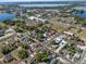 Wide aerial view of a neighborhood near a lake and business district at 304 Ave P Nw, Winter Haven, FL 33881