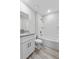 Bathroom featuring white cabinets, granite countertops, and tub with shower at 304 Ave P Nw, Winter Haven, FL 33881