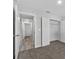Carpeted bedroom features an open closet and view to the hallway at 304 Ave P Nw, Winter Haven, FL 33881