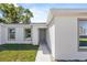Charming single-story home with a well-maintained lawn and neutral-colored exterior at 304 Ave P Nw, Winter Haven, FL 33881