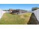 A backyard with a screened in pool and a white fence at 3137 Winchester Estates Loop, Lakeland, FL 33810