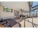 An outdoor patio seating area includes a fan and mounted TV at 3137 Winchester Estates Loop, Lakeland, FL 33810