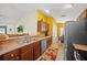 Open kitchen layout with stainless steel appliances and a breakfast bar overlooking the dining area at 3137 Winchester Estates Loop, Lakeland, FL 33810
