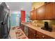 Functional kitchen space with stainless steel appliances and wooden cabinets, adjacent to the living areas at 3137 Winchester Estates Loop, Lakeland, FL 33810