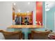 Eat-in kitchen with stainless appliances, wooden cabinets, and breakfast bar seating for casual dining at 3137 Winchester Estates Loop, Lakeland, FL 33810