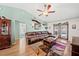 Inviting living room with vaulted ceilings, ceiling fan and access to the outdoor pool area at 3137 Winchester Estates Loop, Lakeland, FL 33810