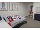 Nautical-themed bedroom with vibrant accents and a comfortable window bench at 317 Wharf Way, Winter Haven, FL 33881