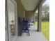 Outdoor lanai with stylish seating, perfect for relaxing and enjoying the scenery at 317 Wharf Way, Winter Haven, FL 33881