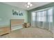 Bedroom with neutral colors, carpet, and a bay window at 3173 Sand Trap Ct, Lakeland, FL 33810