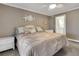 Comfortable bedroom with a ceiling fan, neutral colors, and beach-themed decorations at 3173 Sand Trap Ct, Lakeland, FL 33810