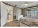 Bedroom with neutral colors, carpet, and access to a lanai and the kitchen at 3173 Sand Trap Ct, Lakeland, FL 33810