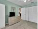 Bedroom with neutral colors, carpet, closet, dresser, and access to the kitchen at 3173 Sand Trap Ct, Lakeland, FL 33810