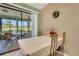 Dining area with furniture adjacent to enclosed lanai with scenic views at 3173 Sand Trap Ct, Lakeland, FL 33810