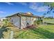 Exterior shot showing a well-maintained side yard and trimmed landscaping at 3173 Sand Trap Ct, Lakeland, FL 33810