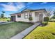 Well-maintained home featuring a tidy lawn and attractive landscaping at 3173 Sand Trap Ct, Lakeland, FL 33810