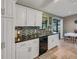 Updated kitchen with granite counters, tiled backsplash, and stainless steel sink at 3173 Sand Trap Ct, Lakeland, FL 33810