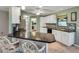 Bright kitchen offers granite countertops, modern appliances, and breakfast bar at 3173 Sand Trap Ct, Lakeland, FL 33810