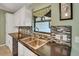 Modern kitchen with tile backsplash, stainless steel sink, and ample counter space at 3173 Sand Trap Ct, Lakeland, FL 33810