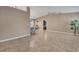 Open-concept living room boasts tiled floors, neutral walls, and airy atmosphere at 3173 Sand Trap Ct, Lakeland, FL 33810