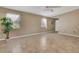 Inviting living room featuring neutral paint, tiled floors, and bright windows at 3173 Sand Trap Ct, Lakeland, FL 33810