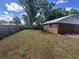 Fenced backyard shows spacious lawn and easy access to home at 330 W Wellington Dr, Lakeland, FL 33813