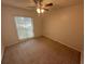 Neutral bedroom with a ceiling fan and a window at 330 W Wellington Dr, Lakeland, FL 33813