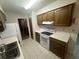 Efficient kitchen features tile floors, ample cabinet space, and modern appliances at 330 W Wellington Dr, Lakeland, FL 33813