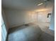 Well-lit living room features neutral-toned carpet, a window, and ceiling fan at 330 W Wellington Dr, Lakeland, FL 33813