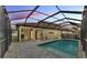 Screened-in backyard with private pool and patio, ideal for outdoor relaxation and entertaining at 3919 Vista Trace Way, Lakeland, FL 33810