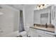 Clean bathroom with a shower-tub combo, white subway tile, and modern vanity at 3919 Vista Trace Way, Lakeland, FL 33810