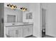 Bathroom showcasing a double sink vanity, granite counters and ample lighting at 3919 Vista Trace Way, Lakeland, FL 33810