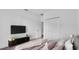 Bright bedroom featuring a closet, television and view of the home's interior at 3919 Vista Trace Way, Lakeland, FL 33810