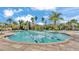 Resort-style community pool featuring lap lanes, fountains, and tropical landscaping under a sunny sky at 3919 Vista Trace Way, Lakeland, FL 33810