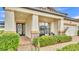 Inviting front entrance with a decorative glass door and a well-manicured garden at 3919 Vista Trace Way, Lakeland, FL 33810