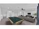 Spacious living room with a pool table, comfortable seating, and modern decor at 3919 Vista Trace Way, Lakeland, FL 33810