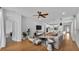 Open-concept living room with wood floors, ample natural light, and modern decor at 3919 Vista Trace Way, Lakeland, FL 33810