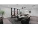 Bright living room featuring large windows, contemporary furniture, and stylish decor at 3919 Vista Trace Way, Lakeland, FL 33810