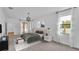 Bright main bedroom with modern furnishings and glass doors leading to the lanai at 3919 Vista Trace Way, Lakeland, FL 33810