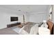 Comfortable main bedroom with a king bed, TV, ensuite bathroom, and ample closet space at 3919 Vista Trace Way, Lakeland, FL 33810
