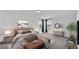 Well-lit main bedroom with a large bed, seating, modern decor, and carpet flooring at 3919 Vista Trace Way, Lakeland, FL 33810