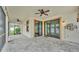 Covered patio with a ceiling fan, tile flooring, and views of the surrounding area at 3919 Vista Trace Way, Lakeland, FL 33810
