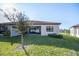 Well-maintained backyard with lush lawn and cozy, screened-in patio area for outdoor relaxation at 4189 Marseille Ln, Lakeland, FL 33810