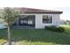 Backyard showcasing a screened-in patio and well-kept lawn, perfect for outdoor living at 4189 Marseille Ln, Lakeland, FL 33810