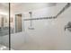 Bathroom featuring a glass-enclosed shower with white tiles and an accessible grab bar at 4189 Marseille Ln, Lakeland, FL 33810