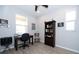 Bright bedroom featuring a ceiling fan, light-colored walls, and two windows at 4189 Marseille Ln, Lakeland, FL 33810