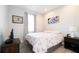 Comfortable bedroom with wood floors, neutral paint, a window, and a serene aesthetic at 4189 Marseille Ln, Lakeland, FL 33810